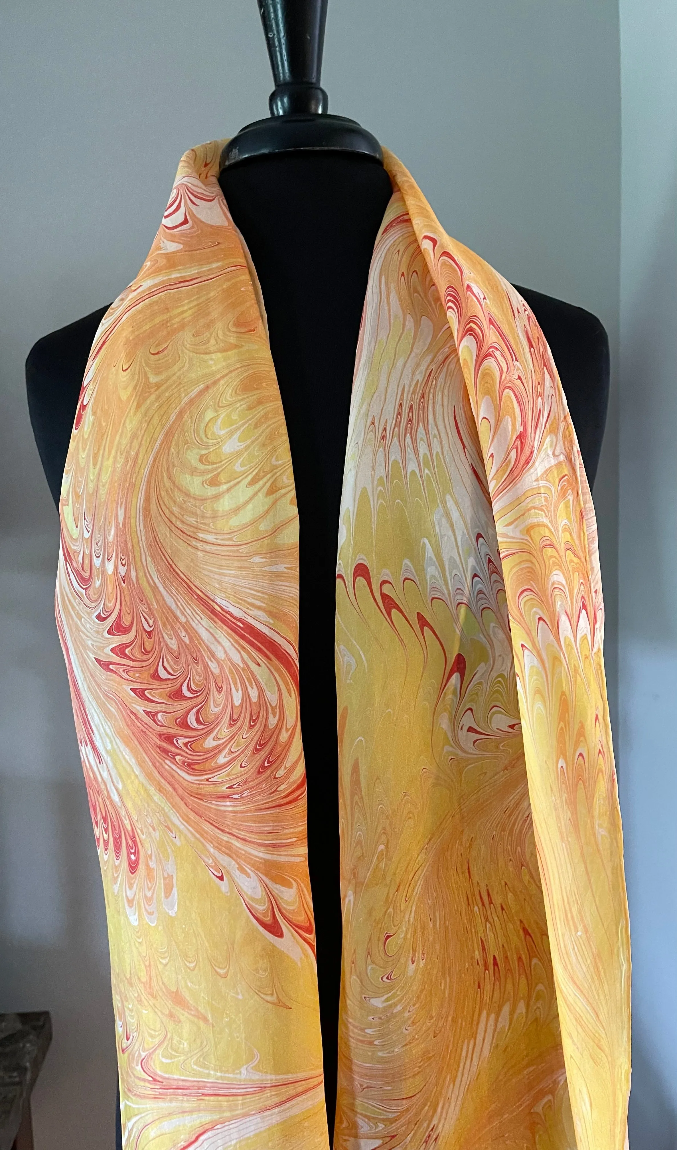 Orange yellow water marbled 8mm Habotai silk.  Hang on the wall, use as a table runner or wear this unique piece
